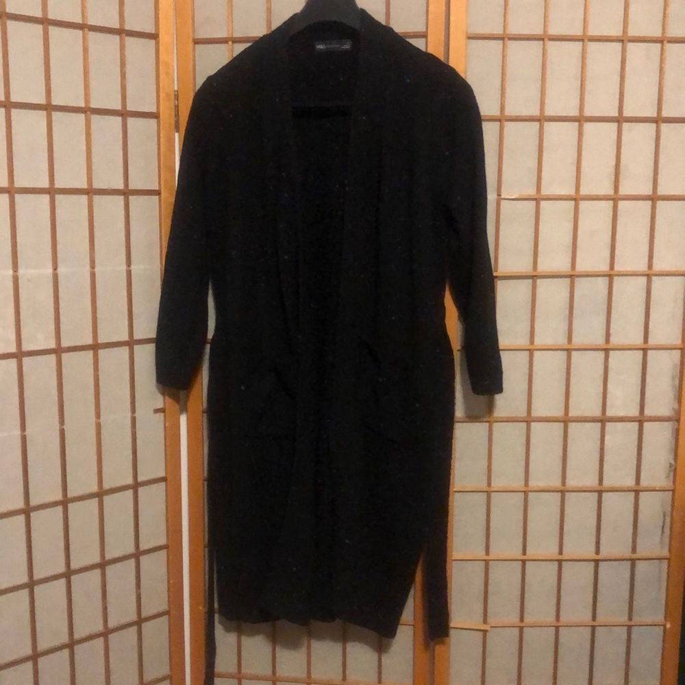 Long sweater jacket with belt.  Black with a few colored fabric spots.